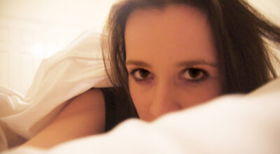 Photography by Alara Baldwin, Alexandra Phillips, Chelsea Hillas, Emily Kalafatis, Furat Alsabti, Gabbie Cirillo, Georgie Evans, Lauren Minicozzi, Margot Craig, Melanie Nixon, Mikaela Cowan, Natalie Sakarintr, Paul Prato, Rebecca Brun and Sarah Mitchell, Year 10, Goulburn Valley Grammar School Student photograph of a girl lying in bed